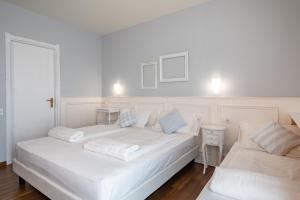 Postel nebo postele na pokoji v ubytování Hotel Speranza + 37 fotografií