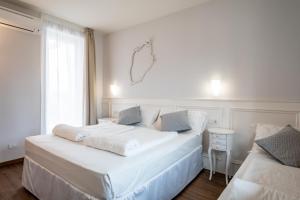 Postel nebo postele na pokoji v ubytování Hotel Speranza