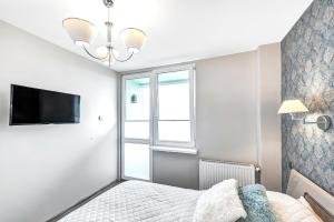 Posteľ alebo postele v izbe v ubytovaní ORION Downtown Apartment by PinPoint