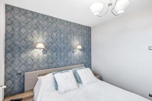 Posteľ alebo postele v izbe v ubytovaní ORION Downtown Apartment by PinPoint