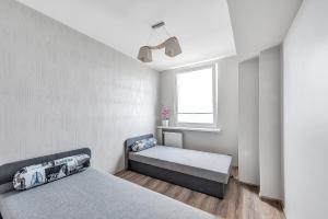 Posteľ alebo postele v izbe v ubytovaní ORION Downtown Apartment by PinPoint