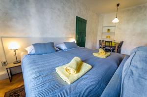 Posteľ alebo postele v izbe v ubytovaní Babylon Apartmány