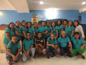 a group of people in blue scrubs posing for a picture at Hotel Virgen del Cisne in Loja