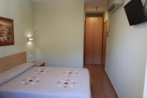 Posteľ alebo postele v izbe v ubytovaní El Camí Hotel