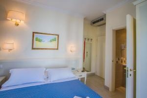 Postel nebo postele na pokoji v ubytování Hotel Nelson