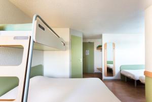 Postel nebo postele na pokoji v ubytování ibis budget Quimper