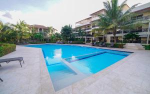 a swimming pool in front of a building at Savoy Hotel Boutique in Las Terrenas