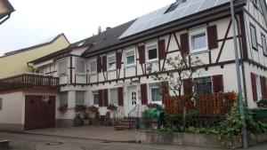 a house with a solar panel on it at Privatzimmer San in Ringsheim