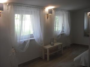 A bed or beds in a room at Levendula Nyaraló