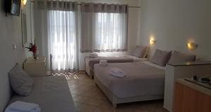 Posteľ alebo postele v izbe v ubytovaní Paros Paradise Apartments