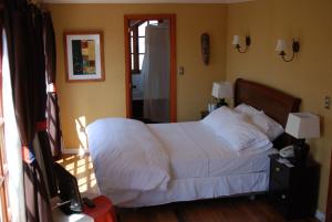 Krevet ili kreveti u jedinici u okviru objekta Hotel Manoir Atkinson