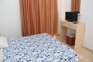 A bed or beds in a room at Nikos Studios Meltemi Family Suite Penthouse