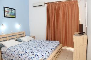 A bed or beds in a room at Nikos Studios Meltemi Family Suite Penthouse