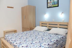 A bed or beds in a room at Nikos Studios Meltemi Family Suite Penthouse