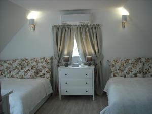 Un pat sau paturi într-o cameră la Levendula Nyaraló