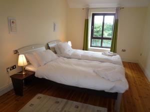 Llit o llits en una habitació de Grove Lodge Holiday Homes