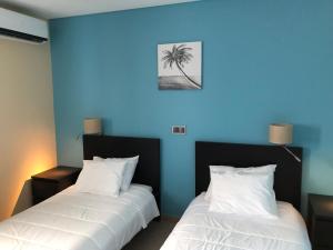 מיטה או מיטות בחדר ב-Apartamentos Basalto