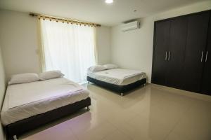 Postel nebo postele na pokoji v ubytování Casa Neguanje L4 + 32 fotografií