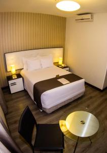 Postel nebo postele na pokoji v ubytování LimaQ Hotel