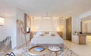 Łóżko lub łóżka w pokoju w obiekcie Gatzara Suites Santa Gertrudis