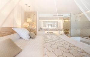Łóżko lub łóżka w pokoju w obiekcie Gatzara Suites Santa Gertrudis