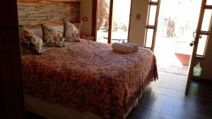 Postel nebo postele na pokoji v ubytování Hostal Puritama