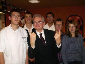 a group of people posing for a picture at Logis Hotel De Paris in Jaligny