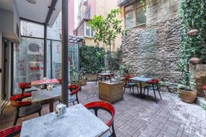 a patio with tables and chairs and a building at Nuru Ziya Suites in Istanbul