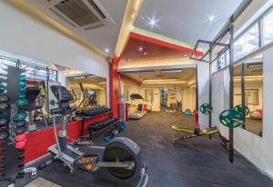 a gym with treadmills and machines in a room at Nuru Ziya Residences in Istanbul