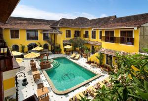 an overhead view of a swimming pool in a house at Forte Kochi in Cochin
