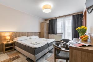 Postel nebo postele na pokoji v ubytování Ośrodek Wypoczynkowy Borowy