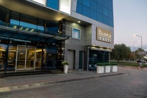 a building with a sign that reads blazing hotel at Blanca Hotel in Izmir