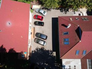 an overhead view of cars parked in a parking lot at Balaton Kinizsi Apartman in Siófok