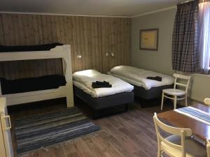 Postel nebo postele na pokoji v ubytování Knappgården