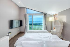 Postel nebo postele na pokoji v ubytování MJ Resort