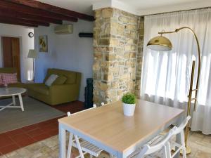 a living room with a table and a couch at Istrian House in Portorož
