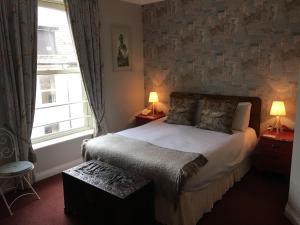 Postel nebo postele na pokoji v ubytování O Donovans Hotel