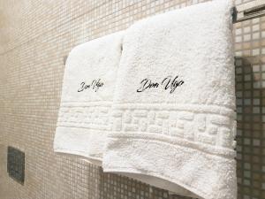 a towel with the words your life written on it at Don Ugo Luxury Rooms in Tropea