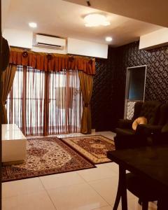 Χώρος καθιστικού στο AHMAD HOMESTAY D'Perdana Apartment KOTA BHARU +47 φωτογραφίες