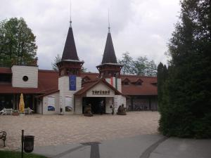 a building with two towers on top of it at Apartman Berki in Hévíz