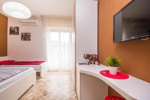 A television and/or entertainment centre at Il Muretto Még 14 kép