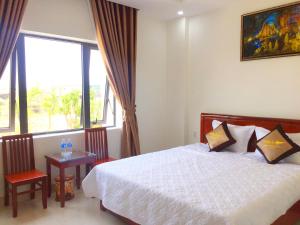 Кровать или кровати в номере Phu Tien Hotel