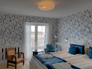Postel nebo postele na pokoji v ubytování Strandhotellet