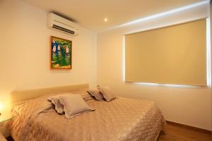 Postel nebo postele na pokoji v ubytování Villa Summer Dreams Apartments