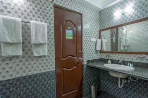 Koupelna v ubytování Rendezvous Beach Resort Panjim