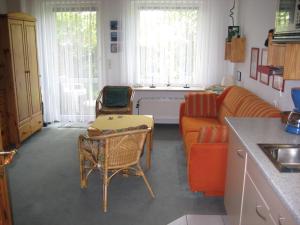 a living room with a couch and a table at Haus Pistorius in Büsum
