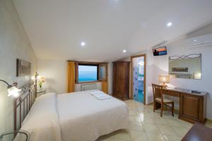 Postel nebo postele na pokoji v ubytování B&B Il Nespolo