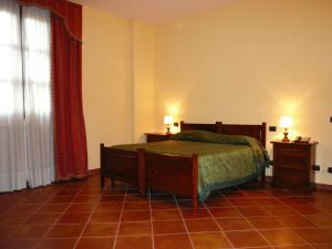A bed or beds in a room at Tenuta Del Massimo Feudo
