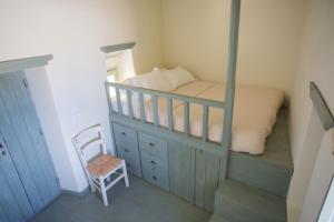 Postel nebo postele na pokoji v ubytování Pyrgos Stone House