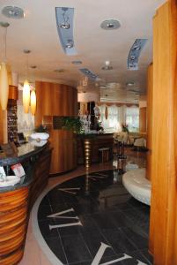 a large room with a kitchen and a living room at Hotel Franz in Bibione